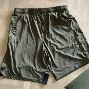 Under armour drawstring shorts.  Print on back of shorts.  Logo on front